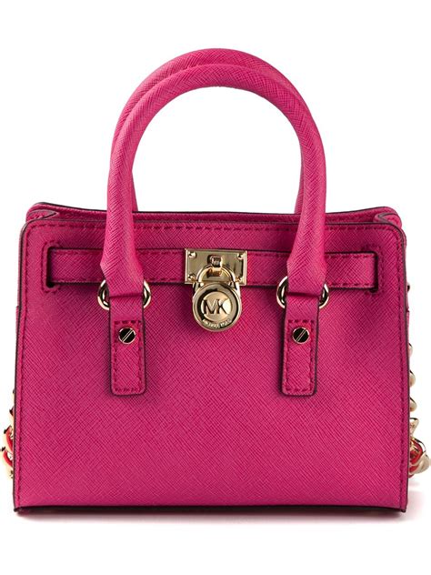 michael kors pink hand bags|Michael Kors pink suitcase.